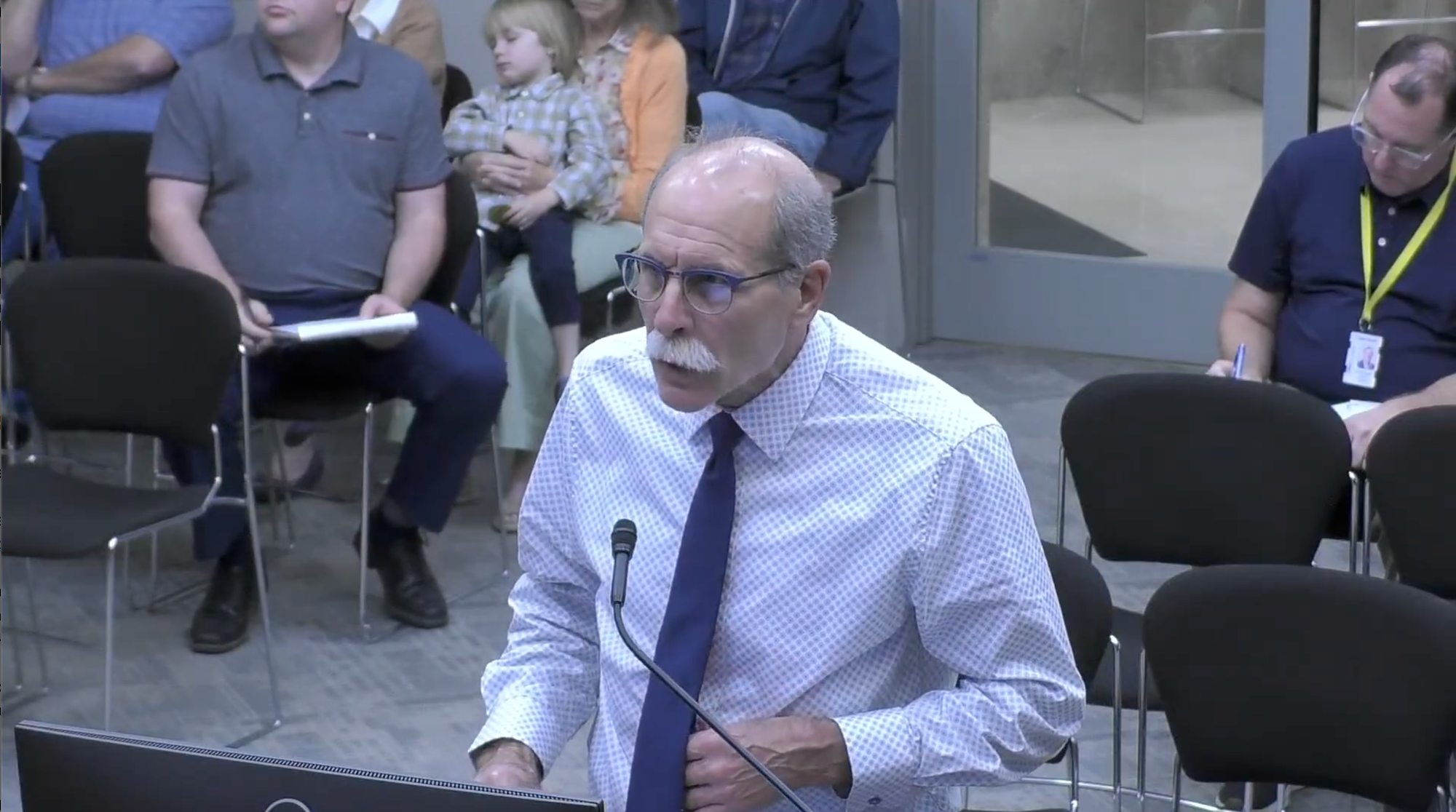 Brian Correa speaking at microphone during Stillwater Planning Commission meeting