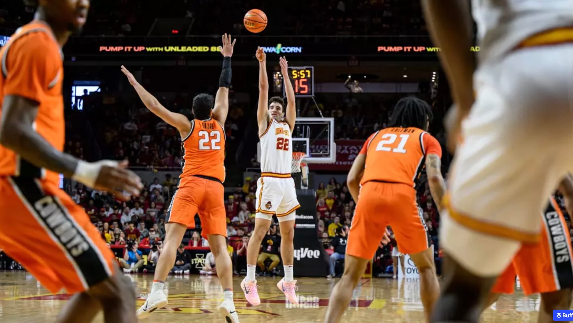Iowa State's Milan Momcilovic shoots over Oklahoma State's Parsa Fallah as Cowboys defenders surround him during the Cyclones' 83-71 Big 12 win at Hilton Coliseum.
