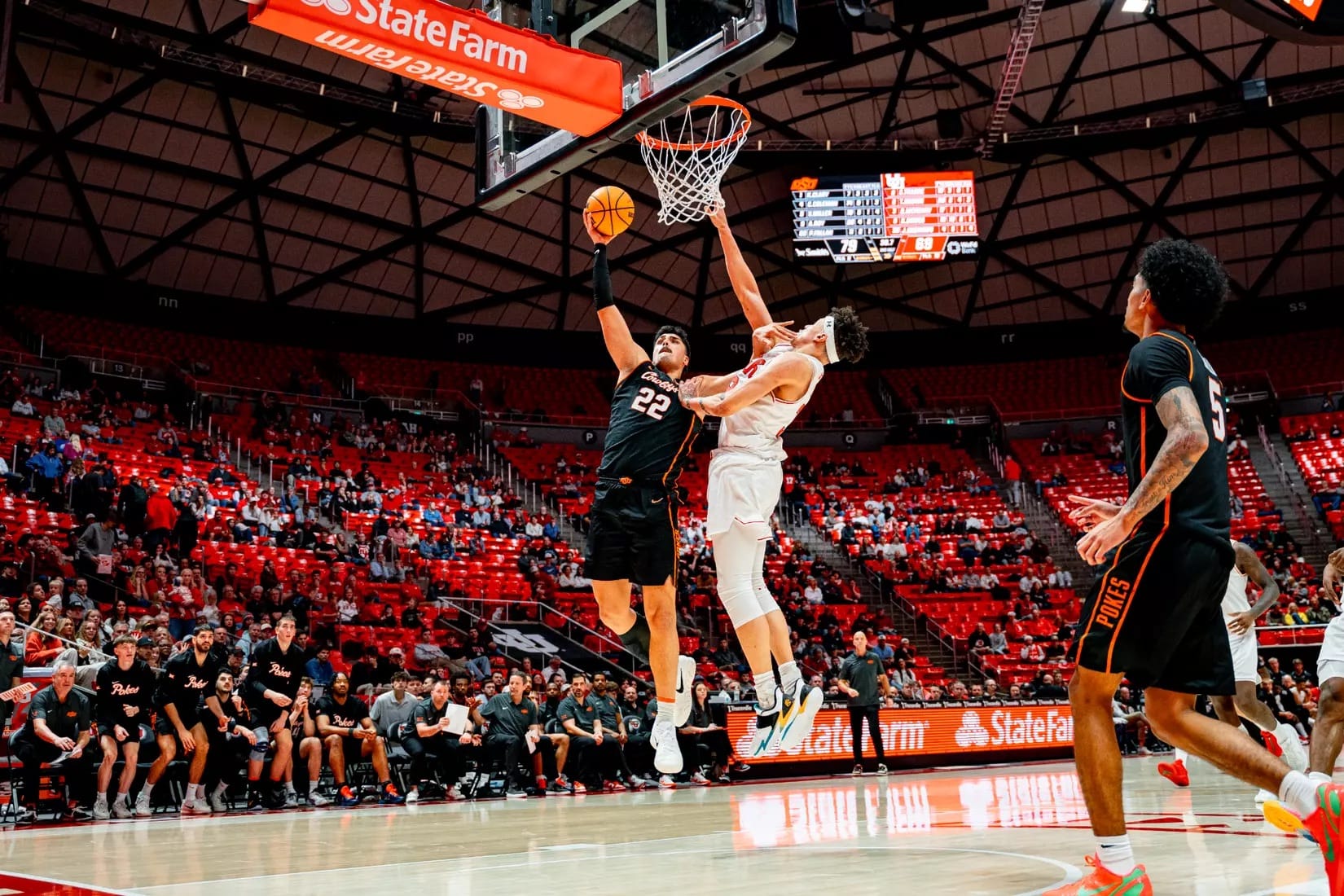 Oklahoma State center Parsa Fallah shoots against Utah defender during Cowboys' 81-69 road win Saturday at Jon M. Huntsman Center in Salt Lake City.