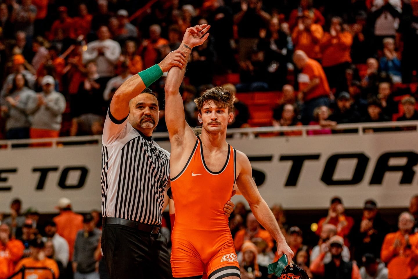 Oklahoma State's Troy Spratley has his hand raised after defeating Iowa State's Stevo Poulin 3-1 at 125 pounds during OSU's 24-9 win over the Cyclones Sunday at Gallagher-Iba Arena.