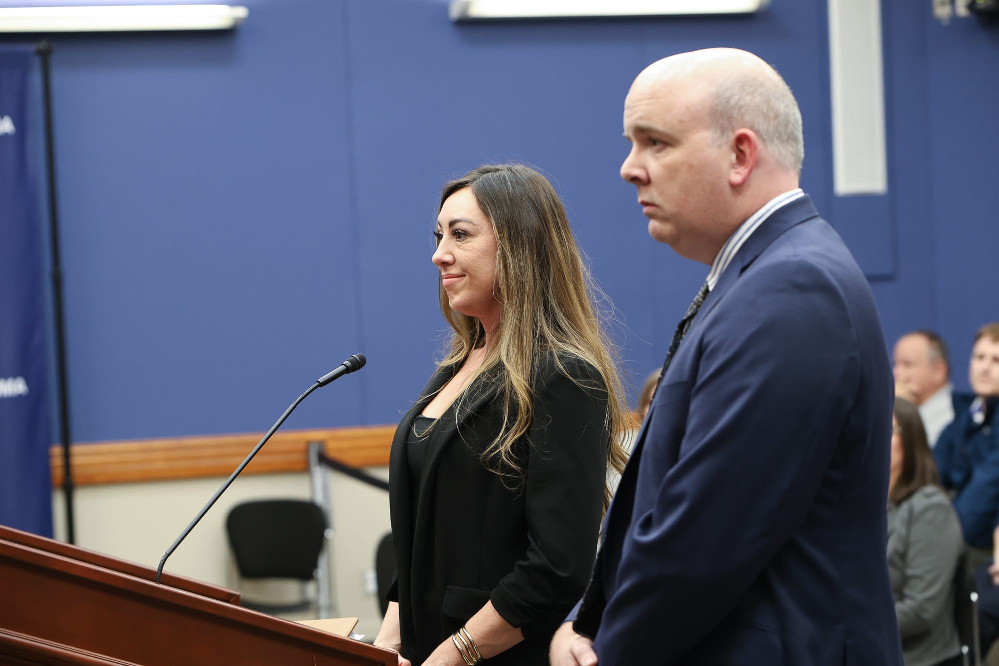 Remington Ranch property manager and Vesta Realty attorney stand at podium addressing Stillwater City Council during public hearing.