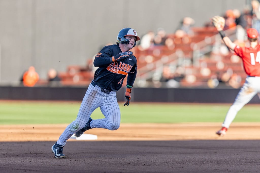 Oklahoma State left fielder Alex Conover (14) rounds second base during OSU's game against Cincinnati on April 4, 2026, at O'Brate Stadium in Stillwater.