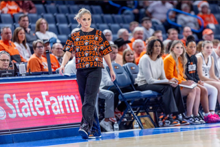 Oklahoma State head coach Jacie Hoyt walks the sideline during the Cowgirls' loss to Oklahoma on December 13, 2025 at Paycom Arena in Oklahoma City.