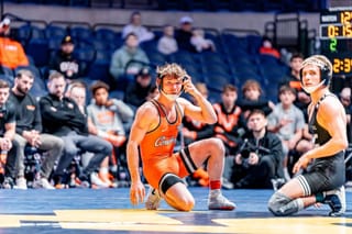 Oklahoma State wrestler Troy Spratley and West Virginia's Jett Strickenberger on the mat during their 125-pound bout at Gallagher-Iba Arena.