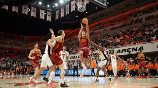 Iowa State guard Milan Momcilovic (22) shoots over Oklahoma State defenders during the Cyclones' 84-71 win at Gallagher-Iba Arena.