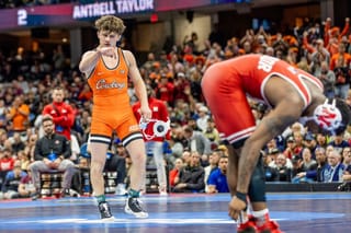 OSU freshman Landon Robideau celebrates on the mat after defeating Nebraska's Antrell Taylor 4-2 in the 157-pound NCAA Championship final at Rocket Arena in Cleveland.
