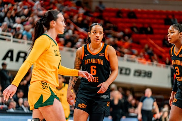 Oklahoma State guard Jadyn Wooten in black uniform during the Cowgirls' 77-68 loss to No. 22 Baylor on New Year's Eve at Gallagher-Iba Arena in Stillwater, Oklahoma.