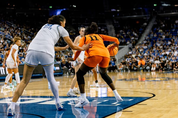 OSU forward Achol Akot (11) and UCLA center Lauren Betts (51) during the Cowgirls' 87-68 NCAA Tournament second-round loss at Pauley Pavilion, March 24, 2026.